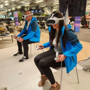 a man and woman wearing virtual reality goggles