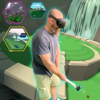 A man playing Mini Golf Challenge in Virtual Reality at office event.